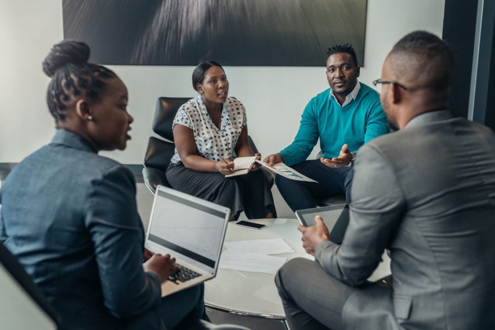 Team of african bussines people debating during a work meeting. Colleagues in serious discussions